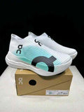 On Cloudboom Strike LS White and Mint Green